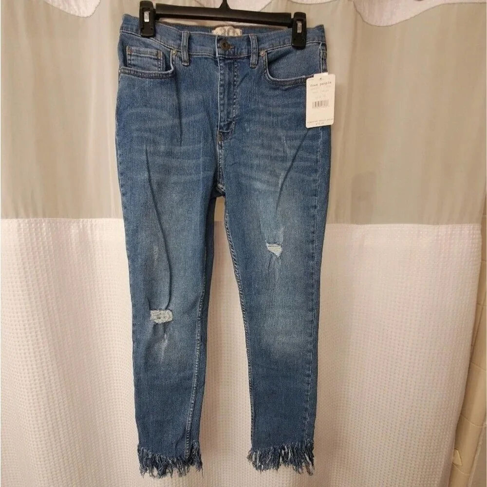 Free People light wash distressed diagonal raw‎ hem jeans size 30 new!!!